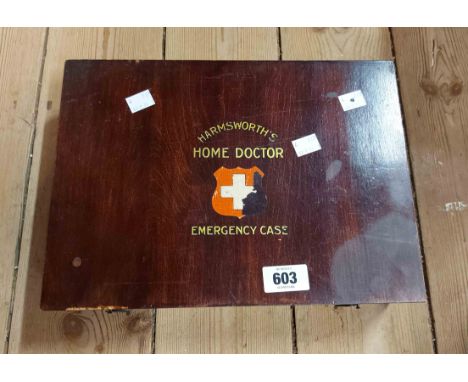 A vintage Harmsworth's Home Doctor Emergency Case first aid kit, the lift-up lid set with printed first aid advice - contents