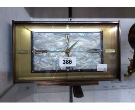 A retro Metamec brass cased electric timepiece with mother-of-pearl effect dial - sold as a collectors' item
