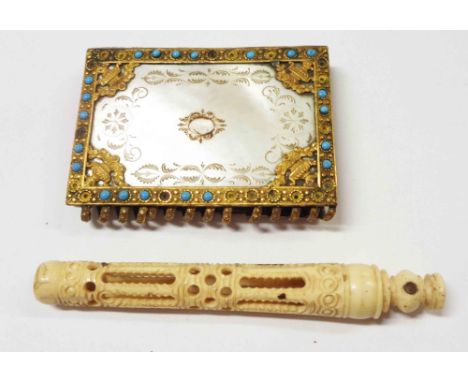 An antique mother-of-pearl clad souvenir notelet book with turquoise cabochon - sold with a 19th Century carved bone needle c