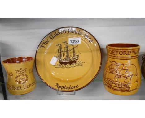 A Harry Juniper Bideford mug with sgraffito decoration depicting a sailing boat, a similar plate made to commemorate the laun