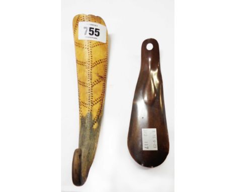 An antique shoehorn made from cow horn with stipple line decoration - sold with a copper similar