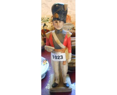 A ceramic spirit flask in the form of a 19th Century soldier