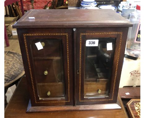 A 34cm Edwardian mahogany and strung smoker's cabinet with fitted interior enclosed by a pair of glazed panel doors