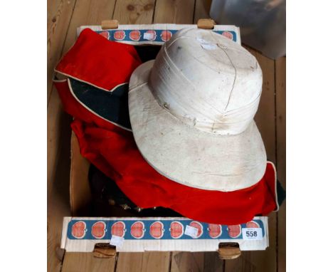 A box containing a quantity of old military uniform coats including red dress jacket (a/f) and an Ellwood's Patent Air Chambe