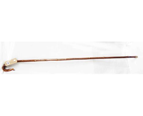 An old wooden shepherd's crook walking stick