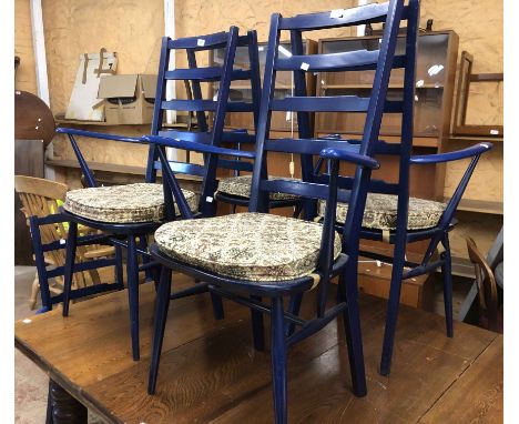 A set of six Ercol dark royal blue painted wood high ladder back elbow chair with moulded seats, set on slender turned suppor