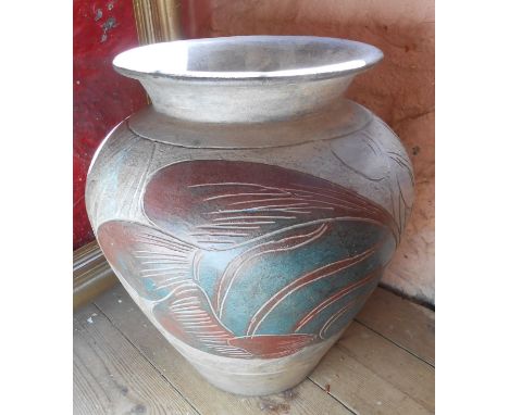 A large modern ceramic vase of urn form with incised fish decoration