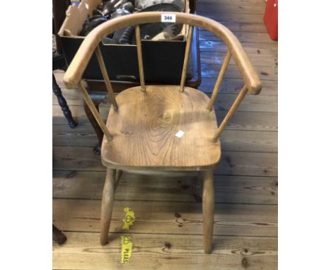 A vintage child's chair bow highchair with moulded solid elm seat, set on simple turned supports