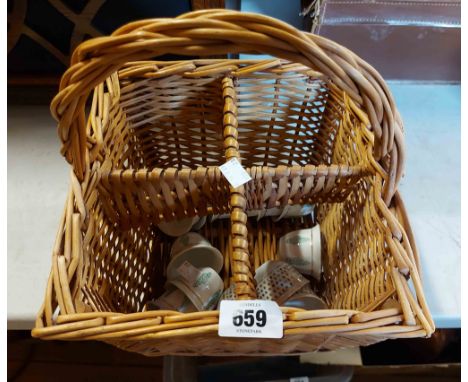 An old wicker four bottle basket containing a quantity of Japanese sake cups