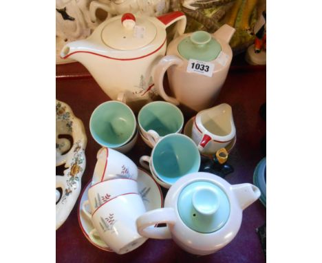 A vintage Crown Devon red stag pattern part coffee set comprising teapot, cream and sugar and three cups and saucers - sold w