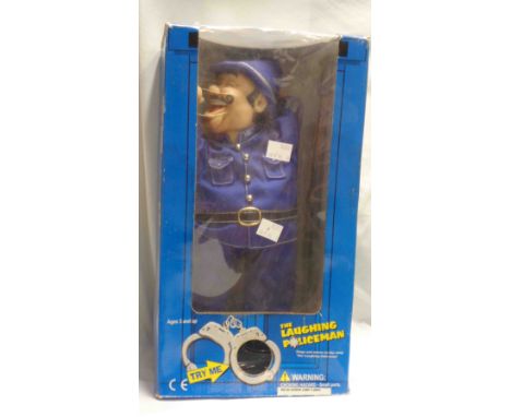 A laughing policeman automaton toy in original box