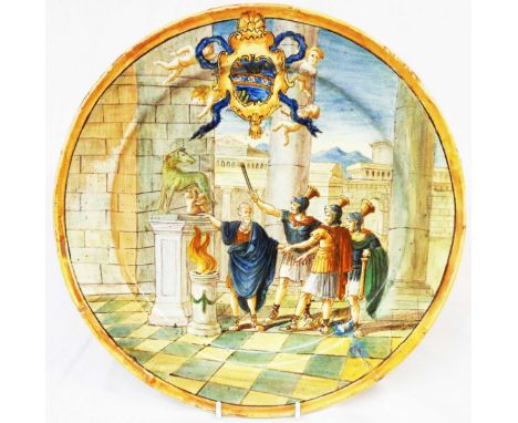 An antique Italian maiolica Castelli plate with all-over hand painted Roman scene with armorial shield above surrounded by fr