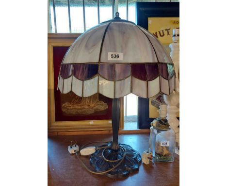 A modern table lamp in the Art Nouveau style with cast metal base and large Tiffany style shade - one pane a/f