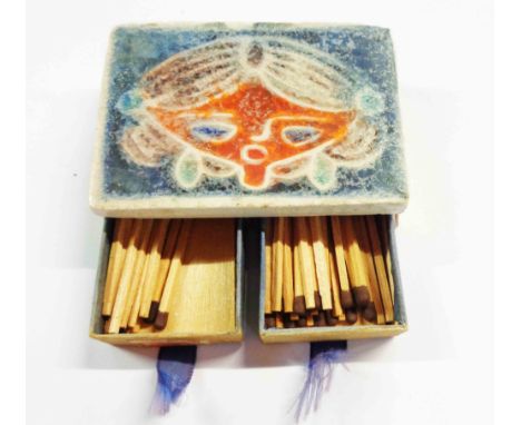 A vintage double matchbox holder with Scandinavian ceramic tile to top, moulded with a stylised girl's head with coloured gla