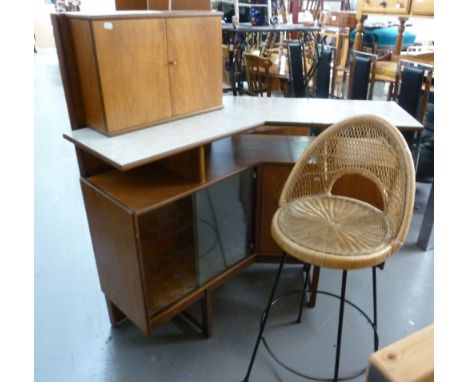 A DIMPLE TEAK BUREAU/WALL UNIT, WITH OPEN COMPARTMENTS AND BUREAU FRONT OVER TWO DOOR CUPBOARD, A FREE STANDING BAR WITH SHEL