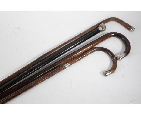 Five silver mounted walking canes, the longest 92cm long (5)