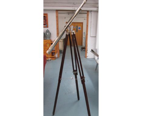 TELESCOPE, silver plated, on a mahogany three-legged tripod support.