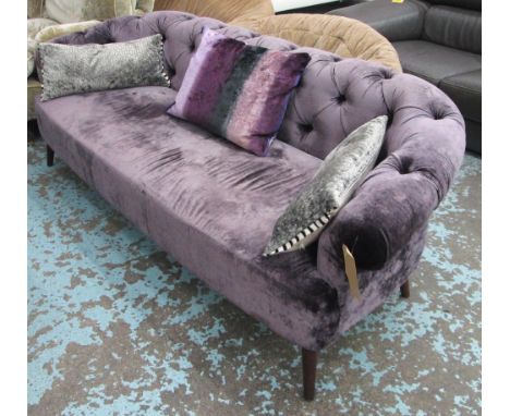 DESIGNERS GUILD SOFA, with a buttoned back and lilac upholstery having three scatter cushions, 218cm L. (with faults)