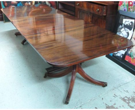 WILLIAM TILLMAN PEDESTAL DINING TABLE, Regency style mahogany with two extra leaves on two turned columns and tripod base on 