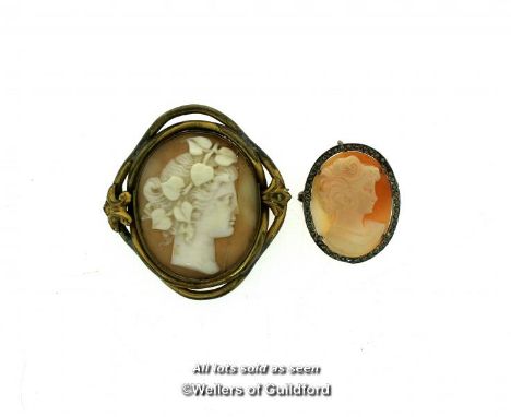 Two shell cameos, each depicting profile of a lady, one with a scroll surround and the other with marcasite surround