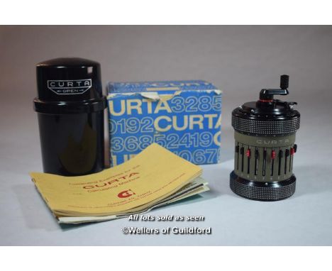 A Curta calculator, type II, No. 558672, with original card box, instruction leaflet and booklet of computing examples for Cu