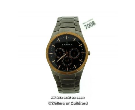 Gentlemen's Skagen Titanium wristwatch, circular black dial with gold coloured bezel, baton hour markers and three subsidiary