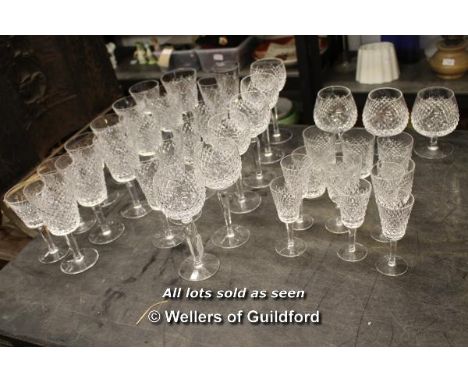 A suite of Waterford glassware in the Alana pattern, comprising six each of tumblers, champagne flutes, hock glasses, large a