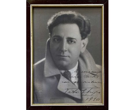 A black and white vintage photoraph signed with inscription by Italian tenor Tito Schipa. Framed. Frame measures 19.5 x 26cm,