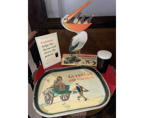 Britain in the Blitz 5 Guinness Advertising items 5 Guinness advertising items. A printed metal tray, LxW, 41x31.5cm, a stand