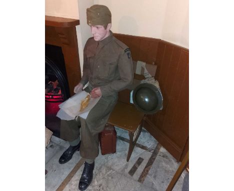 The Station A soldier enjoying his fish and chips in DCLI title badges A soldier dressed in a 1940 Battledress Blouse bearing