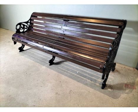 Entrance Iron garden bench A good 19th century style cast iron bench with triple fancy iron supports, indistinct makers mark 