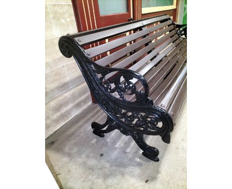 Entrance Cast Iron  garden bench  A good 19th century style cast iron bench with triple fancy iron supports,indistinct makers