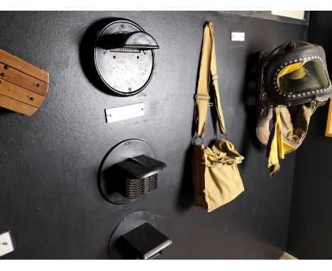 Britain in the Blitz WW2 headlamps etc A group of WW2 display items to include three car headlamp Blackout masks, a wood gas 