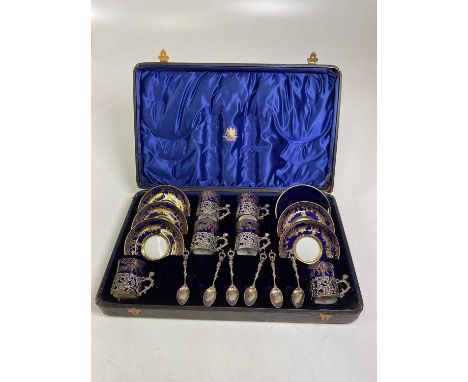 A boxed Mappin Brothers set of six cups and saucers with silver plated cup holders and silver hallmarked spoons.Condition Rep