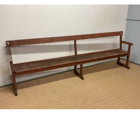 A vintage station waiting room bench, height 91cm, width 274cm.