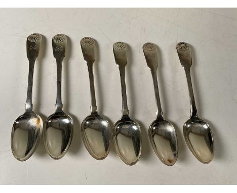 A set of six George III hallmarked silver Fiddle and Shell pattern dessert spoons with engraved crest of a unicorn beside a b