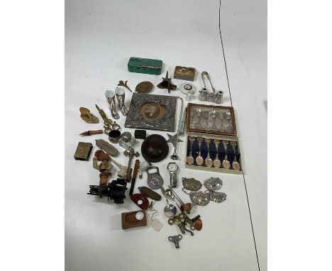 A collectors' lot including a decorative Chinese white metal frame, opera glasses, vintage tin, brass ware, tea spoons and ot