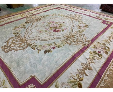 An early 20th century tapestry floor covering in classical French Aubusson style, length 380cm, width 328cm (af).