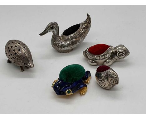 Four contemporary 925 grade silver pin cushions modelled as a hedgehog, duck, chick, and tortoise, also an enamel decorated b