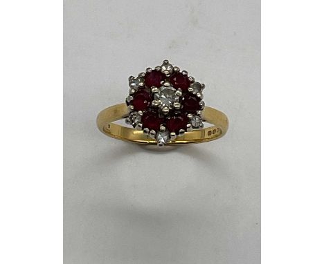 An 18ct yellow gold ruby and diamond dress ring, size O 1/2, approx. 4.6g.