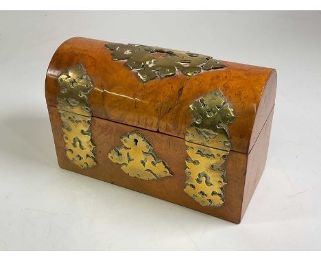 A walnut caddy with brass detail, height 18cm, width 29cm.