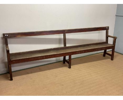 A vintage station waiting room bench, height 90cm, width 277cm.