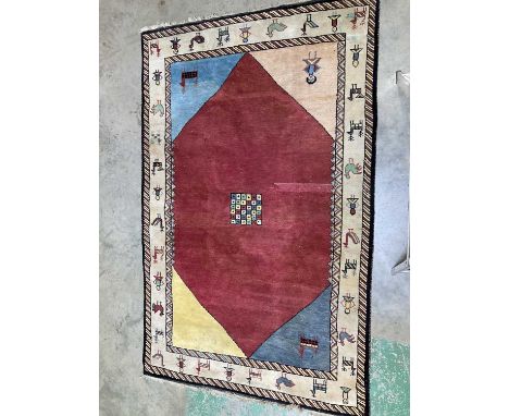 A vintage woollen pile rug depicting animals and people, 280 x 178cm.