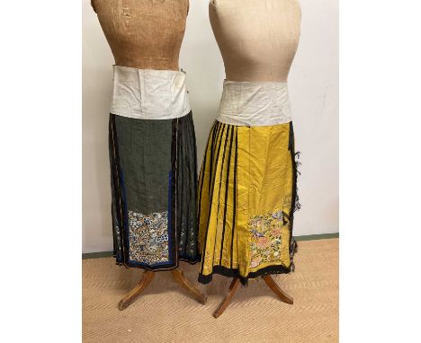 Chinese Vintage embroidered silk apron skirts, one yellow with embroidered panel depicting flowers and birds and the other gr