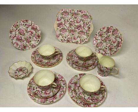 SHELLEY; a part tea set in 'Mayflower' chintz design, including a cake plate, four trios, a jug and bowl, also two additional