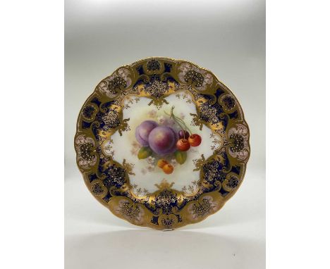 ALBERT SHUCK FOR ROYAL WORCESTER; a gilt heightened fruit painted cabinet plate, puce printed marks with painted number 8346,