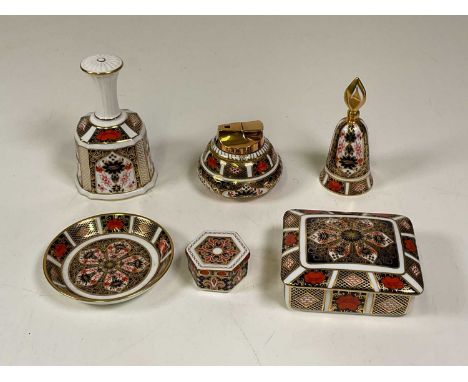 Royal Crown Derby bell, two trinket boxes, table lighter, pin dish and a candle sniffer.Condition Report: The only damage reg