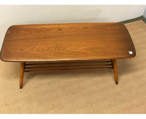 ERCOL; a coffee table with slatted magazine undertier, height 36cm, length 105cm, depth 47cm.