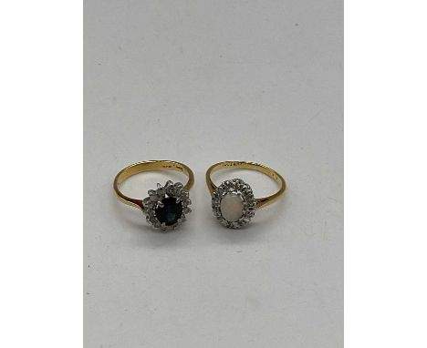 An 18ct yellow gold diamond and opal oval cluster ring, size N, approx. 3.4g, and a yellow metal diamond and sapphire oval cl