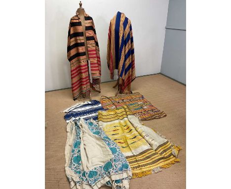 Vintage textiles; a collection of Eastern striped shawls, throws, table coverings and other items